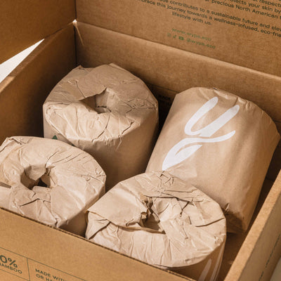 Close-up of Wype’s unbleached bamboo toilet paper rolls in compostable paper wrapping